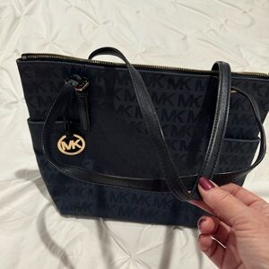 Michael Kors navy canvas monogram bag.